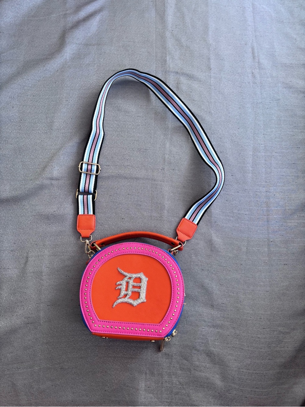 Detroit Tigers Logo Pink and Orange Round Crossbody Bag with Stripe Strap .